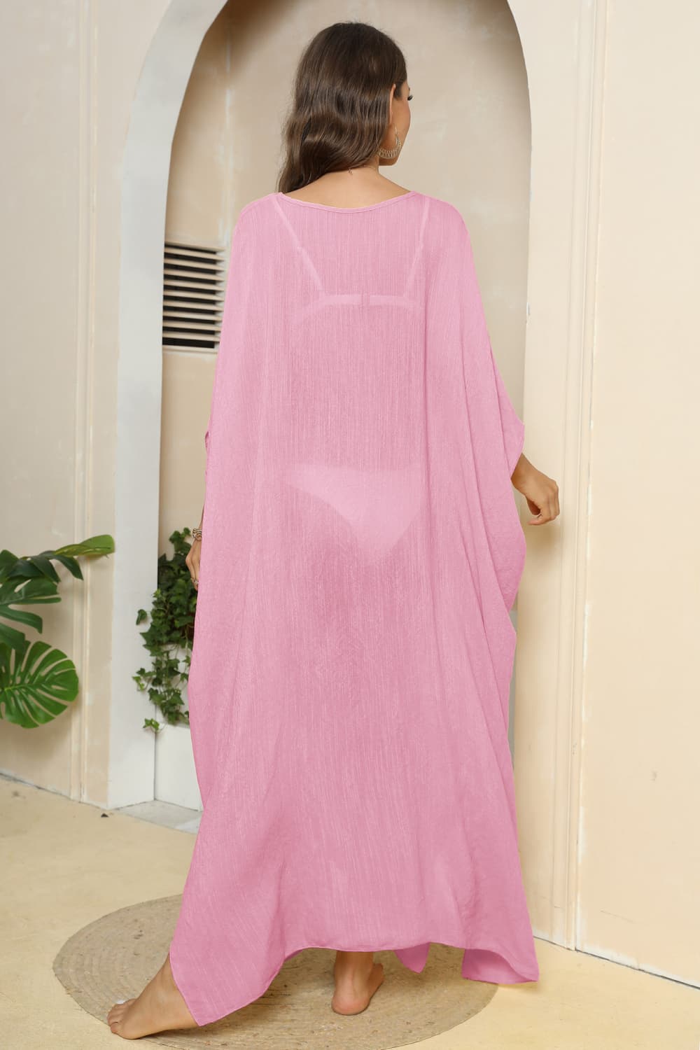 Pink oversized caftan cover-up with side slits, sheer fabric, V-neck, flowing sleeves