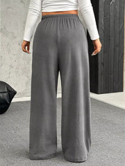 Maternity pants in gray with a drawstring waist and wide legs.