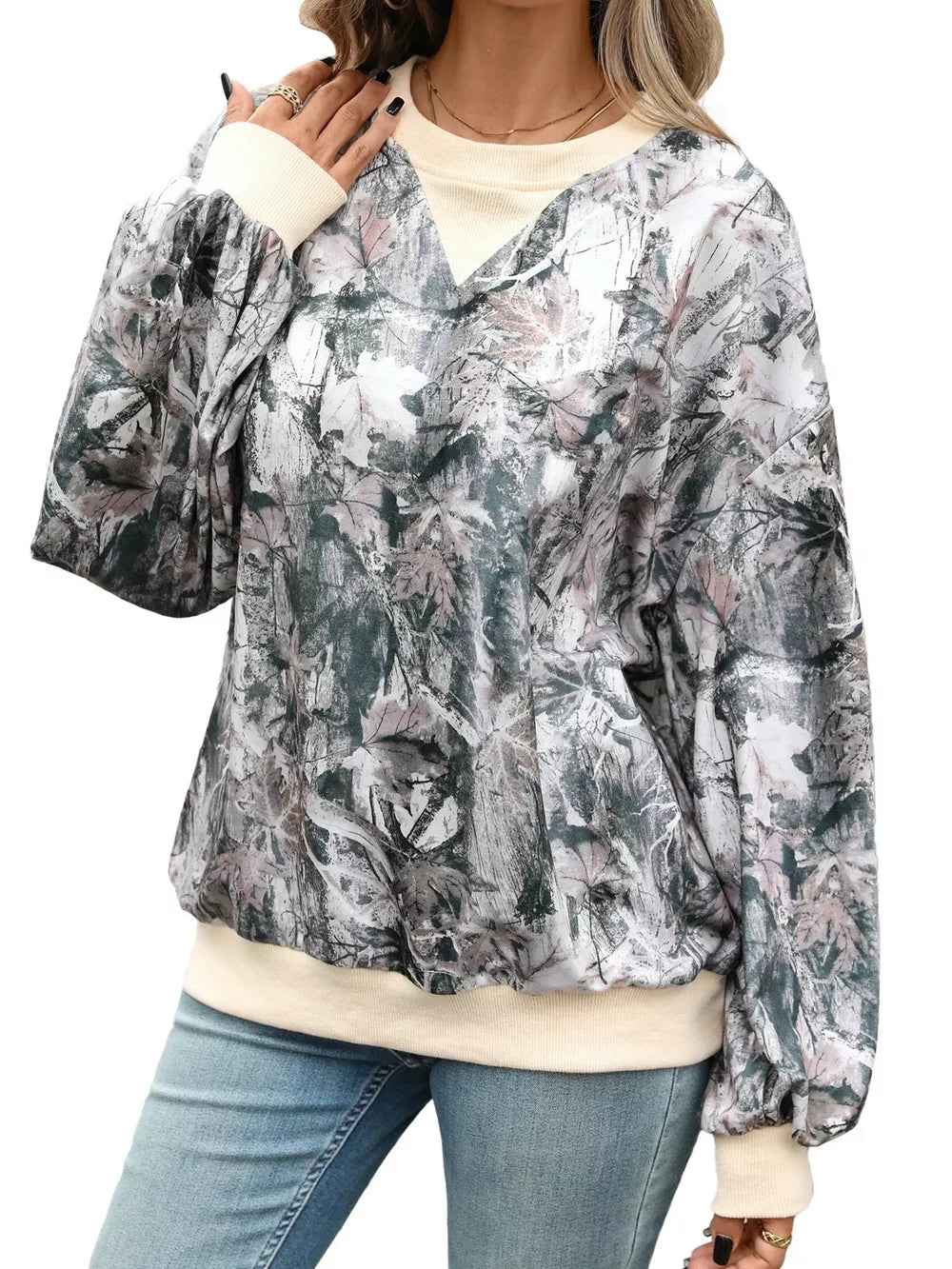 dark grey sweatshirt with leaf-print and v-neck