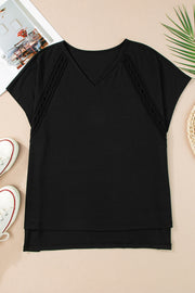 Black dolman sleeve blouse with perforated trim and V-neck