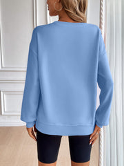 Light blue relaxed fit sweatshirt with crewneck and long sleeves.