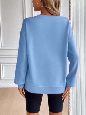 Light blue relaxed fit sweatshirt with crewneck and long sleeves.