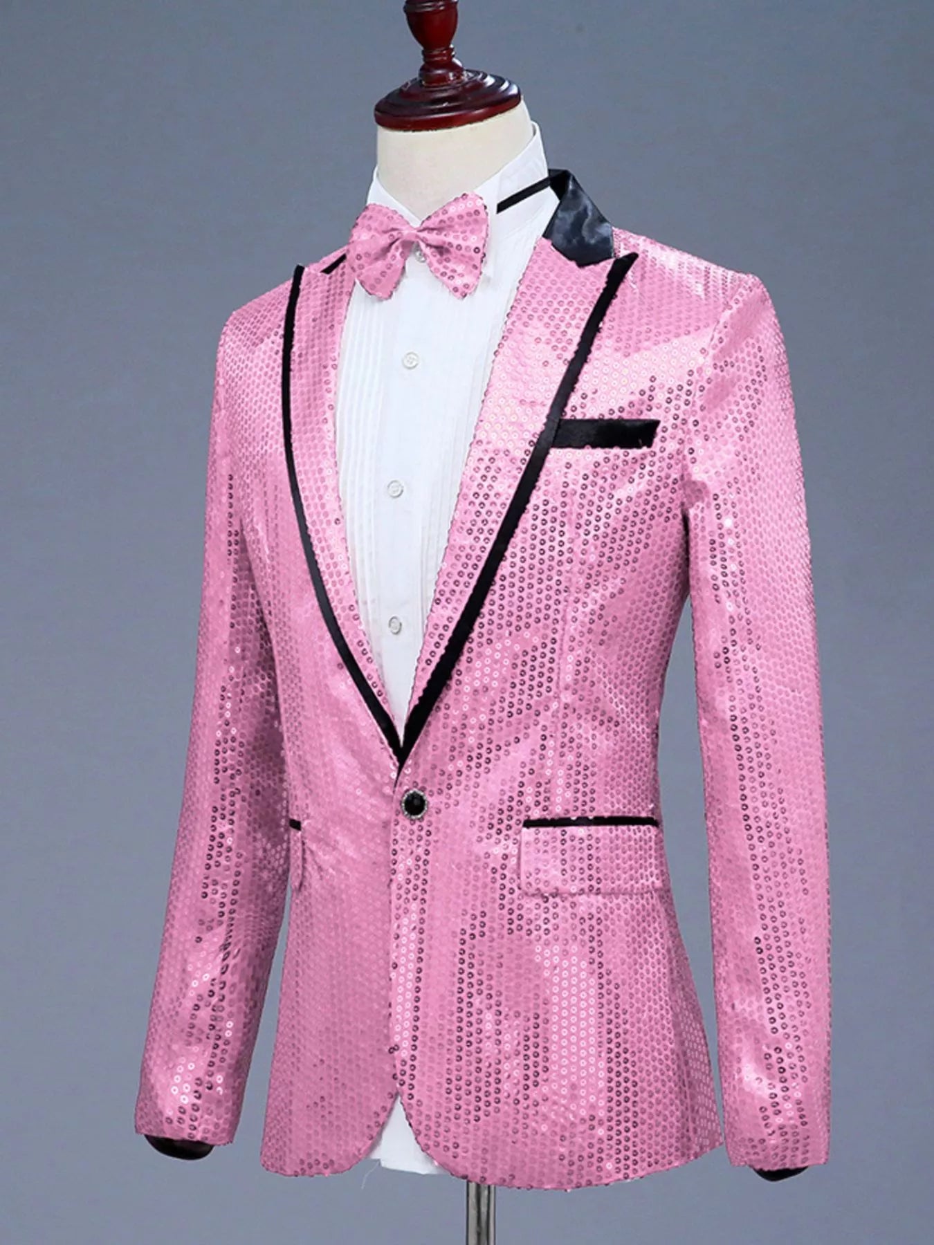 Men's pink sequin one-button tuxedo blazer with black lapels and trim.
