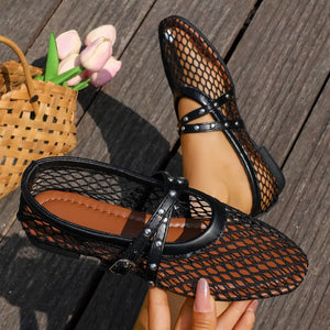 Black studded crisscross mesh slip-on flats with buckle detail.