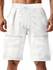 White quilted texture drawstring chino shorts with diamond pattern detail.