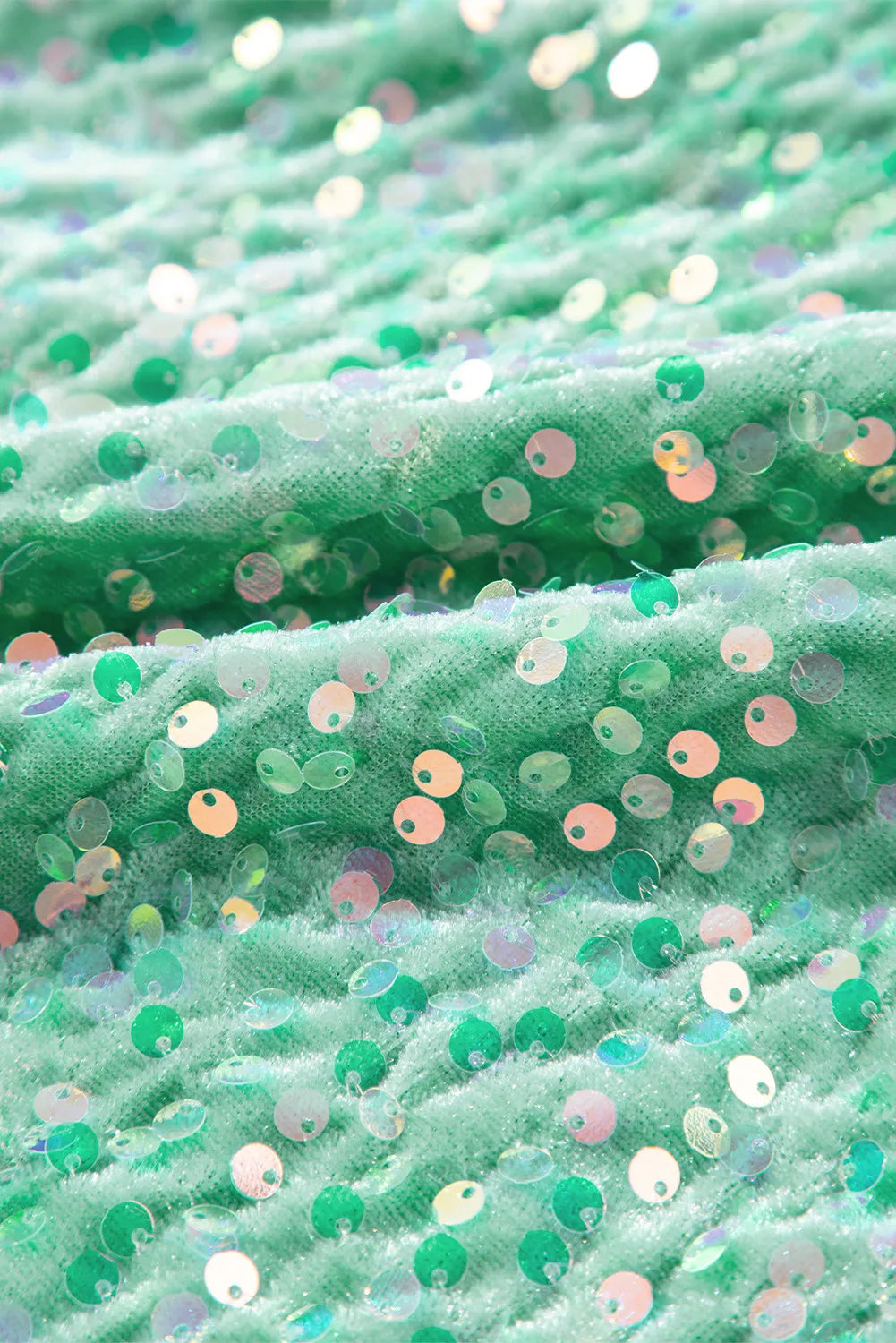Sequin embellished dolman sleeve top in gum leaf green with iridescent sequins.