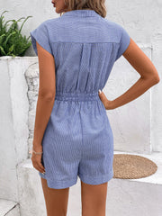 Blue striped shirting romper with elastic waist tie and short sleeves.