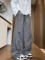 Men's gray plaid loose fit sweatpants with drawstring waist.