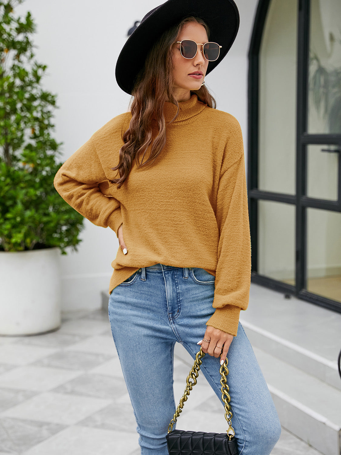 Textured mock neck knit sweater in honey, with long sleeves and a relaxed fit.