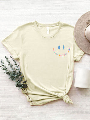 Cream vintage wash t-shirt with smiley face graphic and affirmation text Be Kind To Your Mind.