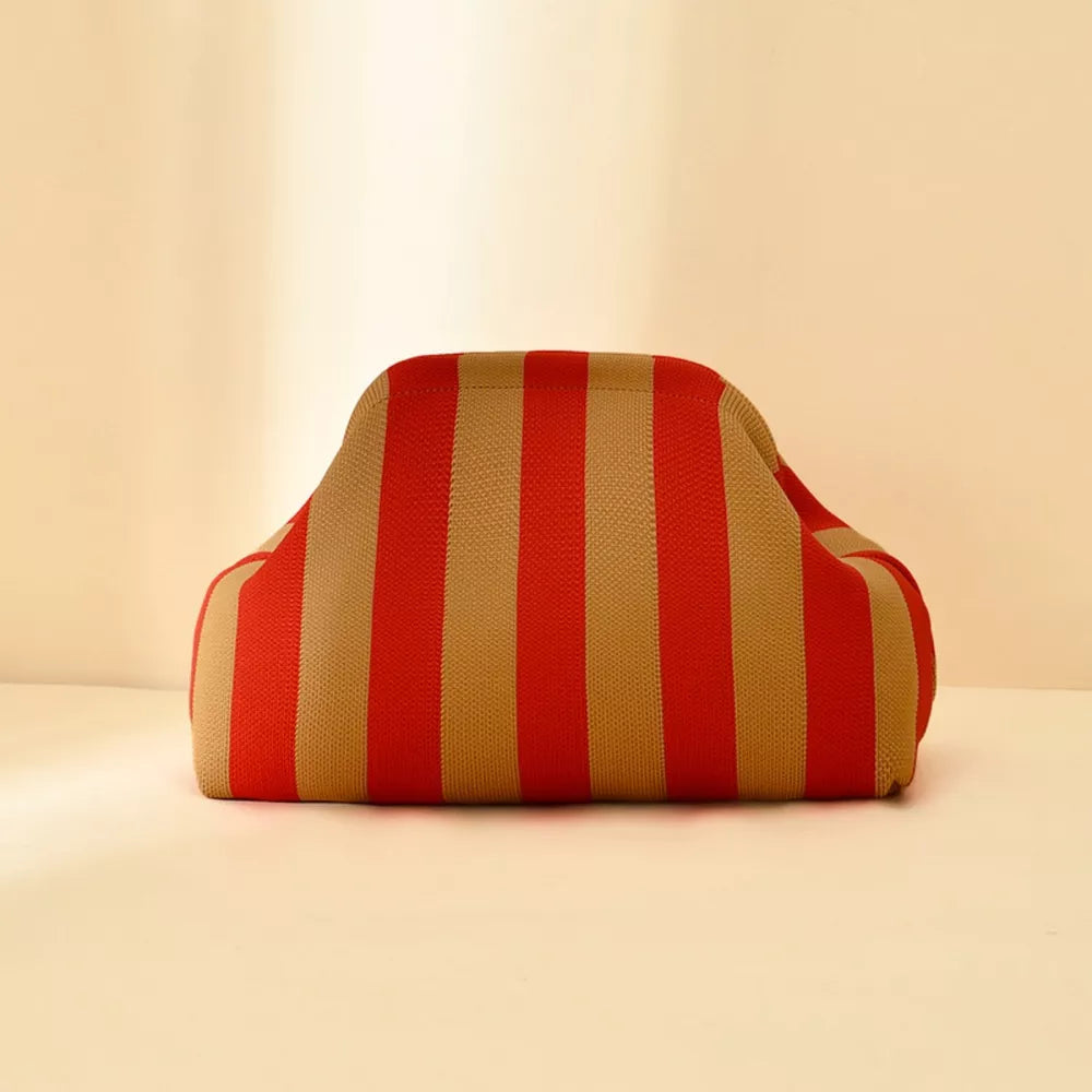 Vibrant knit clutch with striking red and tan stripes
