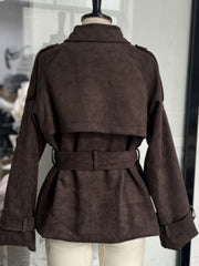 Brown lapel collar belted trench coat with tie waist and buttoned cuffs.
