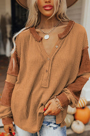 Caramel waffle henley top with contrast stitching on sleeves and collar, button front.