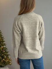Khaki ribbed turtleneck sweater with subtle sparkle detail