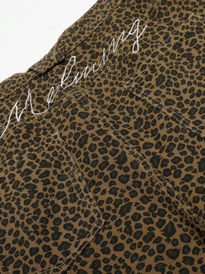 Men's brown leopard print capris with white embroidered text detail.
