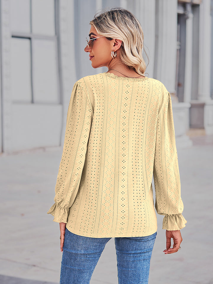 Lemon eyelet blouse with lace trim and ruffle cuffs.