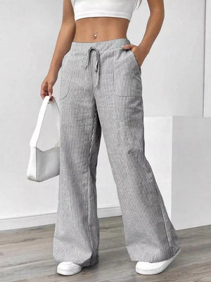 Chic striped drawstring pants with pockets and a wide leg, in gray and white.