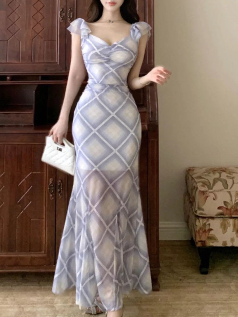 Blue ruched plaid bodycon maxi dress with ruffled cap sleeves and sweetheart neckline.