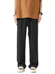 Men's black wide leg sweatpants with drawstring waist and pleats