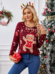Burgundy knit sweater with gingerbread man and "Sweet Christmas" graphic, crew neck, long sleeves.