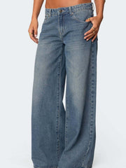 Dark blue wide leg denim jeans with button fly and classic five pocket styling.