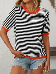 Retro stripe knit tee with contrast trim in black and white, featuring orange trim.