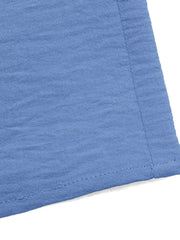 Blue textured wide-leg romper detail with visible stitching.