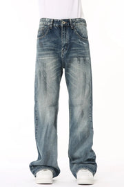 Baggy distressed denim flare jeans in medium wash, featuring a relaxed fit and casual style.