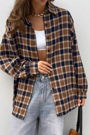 Oversized brown plaid button-up shirt jacket with buttoned cuffs and a collared neckline.
