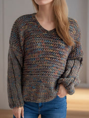 Textured knit sweater with balloon sleeves and V-neck in a multicolor flecked pattern.
