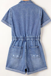Medium wash denim romper with elastic waist, short sleeves, and distressed back pockets.