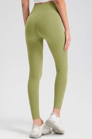 Matcha green high-waist performance leggings with sculpting seam detail.