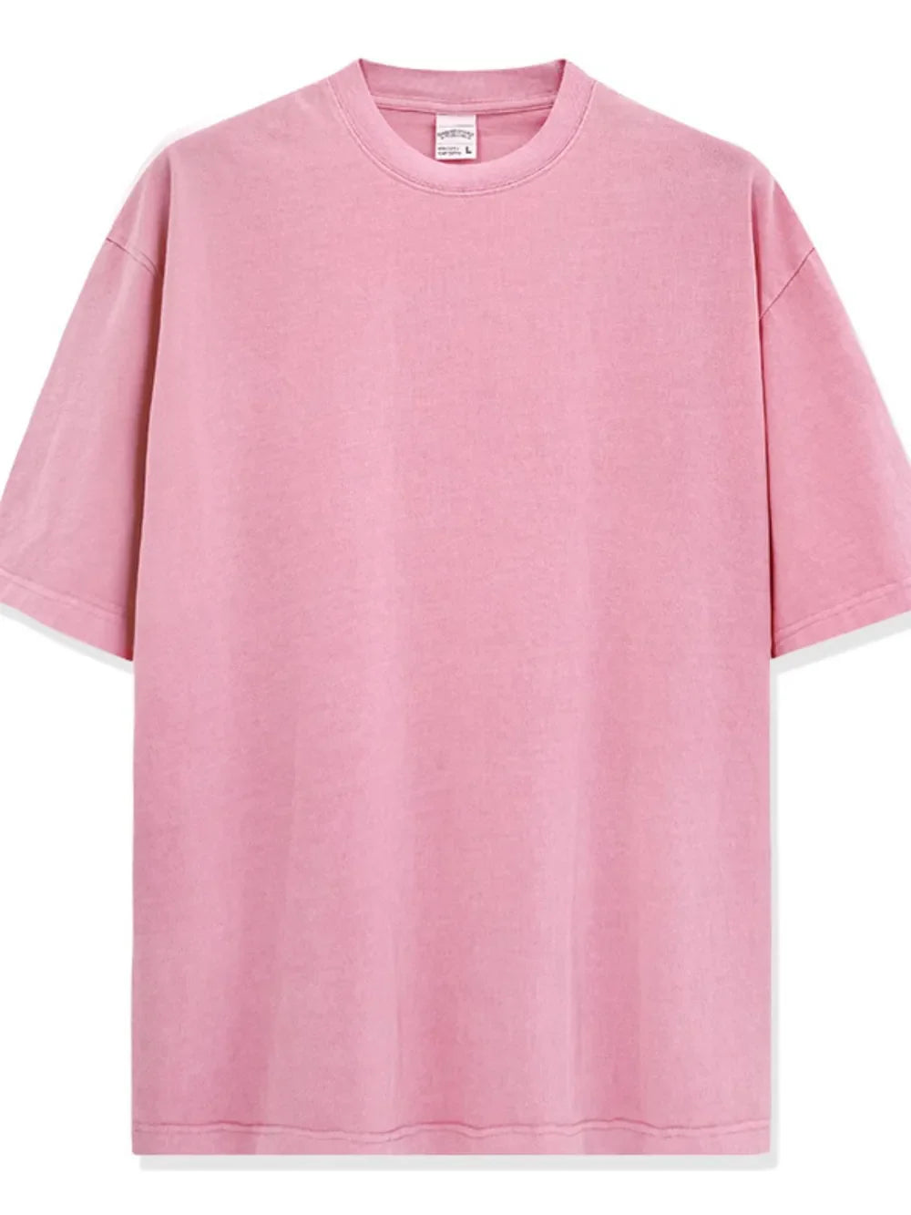Oversized pink pigment-dyed crewneck t-shirt with short sleeves and a relaxed fit.