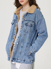 Sherpa-lined oversized acid wash denim trucker jacket with collar and button details.
