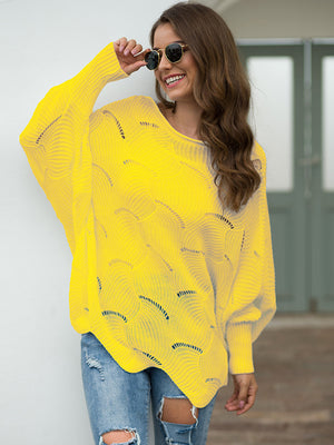 Yellow knit sweater with boat neck and balloon sleeves featuring a scalloped pattern.