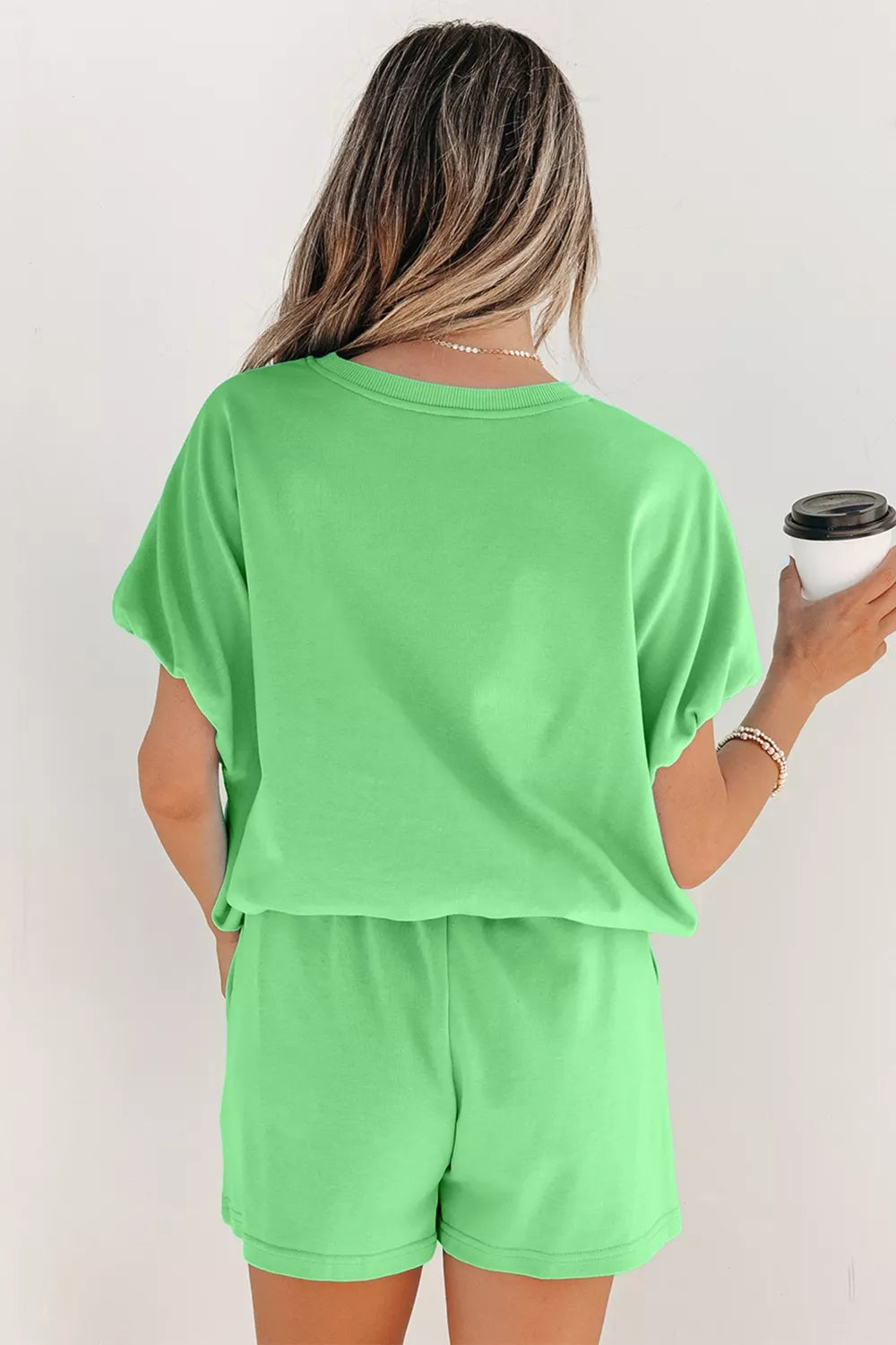 Green cotton two-piece outfit set with drawstring shorts and a relaxed fit t-shirt.