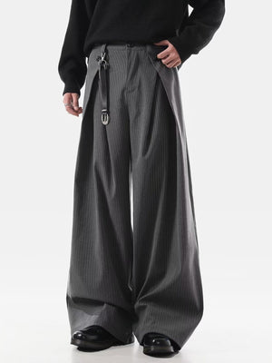 Men's grey pinstripe wide leg sweatpants with pleats and a belt detail.