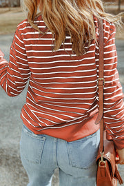 Nautical stripe crewneck sweatshirt in red orange with white stripes, casual long sleeves.