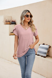 Blush pink knit top with perforated details and flutter sleeves