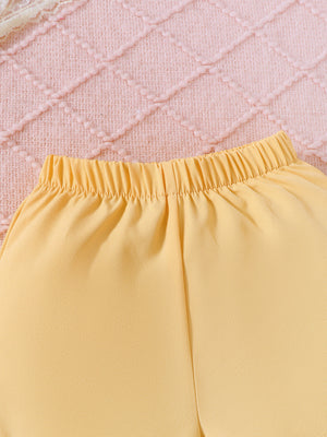 Yellow baby shorts with elastic waistband