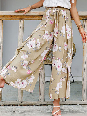 Floral wide-leg palazzo pants with high slits and a self-tie waist.