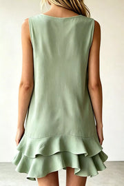 Sage green sleeveless mini dress with tiered ruffle hem detail