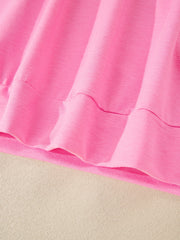 Pink cotton bikini bottoms with drawstring detail and ruffled hem