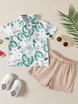 Baby tropical print short sleeve shirt and tan shorts set made of cotton.