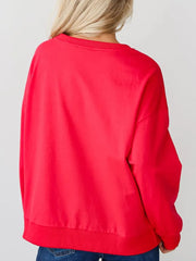 Red crewneck sweatshirt with embroidered Santa Baby graphic on front.