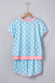 Pastel blue polka dot pajama set with pink contrast trim.
