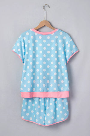 Pastel blue polka dot pajama set with pink contrast trim.