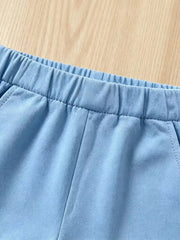 Baby blue cotton shorts with elastic waistband and pockets.