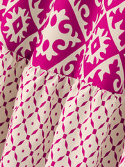 Tiered maxi skirt in hot pink and beige medallion print with ruffled tiers.