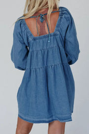 Tiered denim mini dress with square neck and tie back detail.